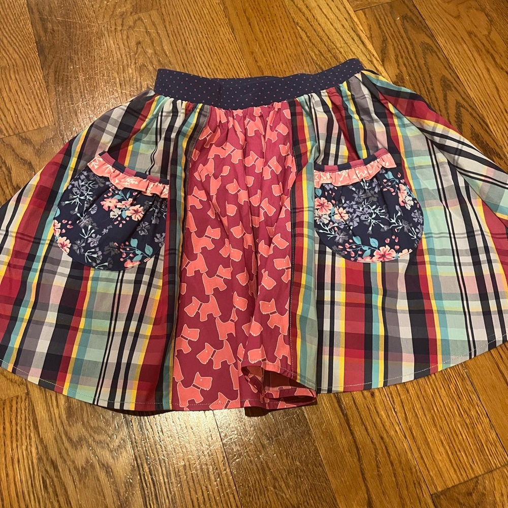 Wildflowers Multicolor Plaid and Floral Kids Skirt. Twins have 2 available